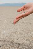 hand drops sand