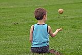 Boy Tossing Ball
