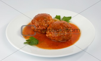 Meatballs with mushrooms in tomato sauce.