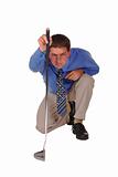 Professional Man Blue Shirt Black Tie focussing over golf club p