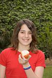 Young teenager eating an apple