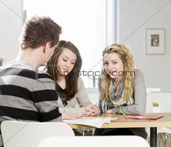 Two girls and a man talking
