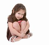 Expressive Young Child Hugging Her Legs