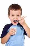 Little boy eating yogurt