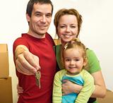 Family in their new home - showing the key