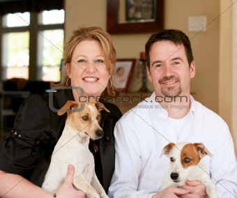 Happy Couple with Their Dogs