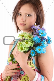 Young girl with camomiles .