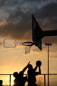 basketball players at the sunset
