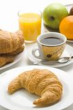 delicious continental breakfast of coffee and croissants 