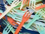Pile Of Coloured Plastic Take Away Forks