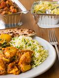 Plate Of Indian Take Away- Chicken Bhoona, Sag Aloo, Pilau Rice 