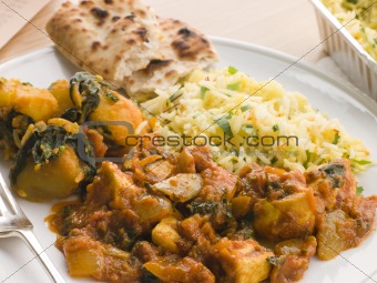 Chicken Bhoona, Sag Aloo, Pilau Rice And Naan Bread