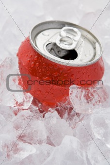 Red Can Of Fizzy Soft Drink Set In Ice With The Ring Pulled 