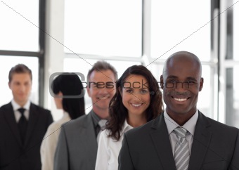 Five person Business team looking at camera and smiling 