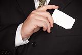 Businessman with Coat and Tie Holding Blank Business Card.