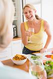 Woman Talking To Friend While Preparing meal,mealtime