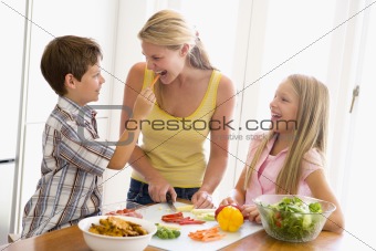 Mother And Children Prepare A meal,mealtime Together 