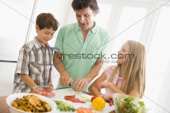 Father And Children Prepare A meal,mealtime Together 
