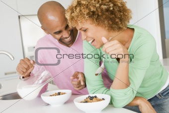 Husband And Wife Eating Breakfast Together