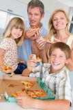 Family Eating Pizza Together 