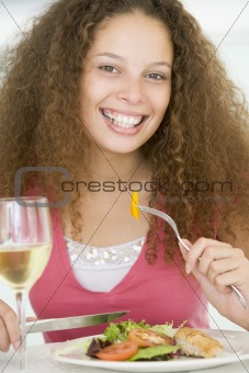 Woman Eating meal,mealtime With A Glass Of Wine 