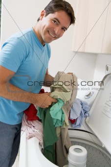 Man Loading Washing Machine