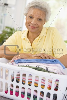 Woman Leaning On Washing Basket 