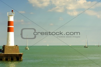 Lighthouse with Sailboats