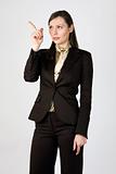 Young business woman pointing