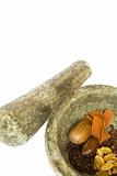 spices and stone pestle and mortar isolated