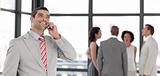 Businessman on the phone in front of business team