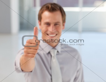 Young Businessman with Thumb up to the camera