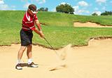 Senior golfer playing golf from sand bunker
