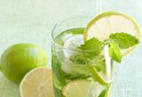 Mojito cocktail on green background