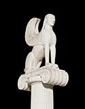 Large ancient Greek sphinx statue fixed on an ionic pillar capital