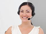 Beautiful International Business woman on a Headset smiling