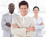Business man smiling in front of Business team 