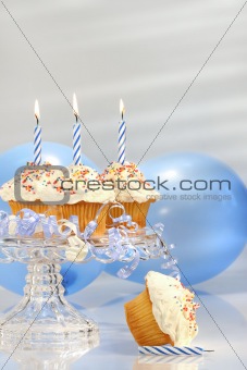 Birthday cupcakes with blue candles