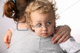 Kid on mothers hands.