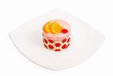 Cake with a cherry and an orange 