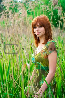 Portrait of a beautiful woman with red hair