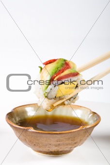 sushi dipping in vinegar