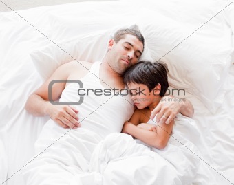 Father and Son Lying on bed 
