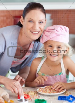 Mother and childing in Kitchen Smiling at Camera