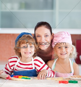 Mother with her Two Kids looking at the camera smiling