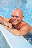 happy mature man in the swimming pool