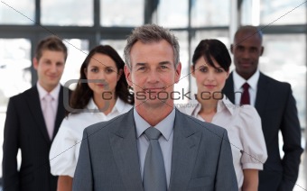 Senior Business man in Front of team