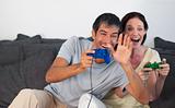 Couple on Sofa Playing Video Games