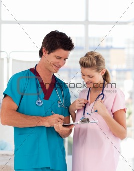 Portrait of doctor with attractive nurse in hospital