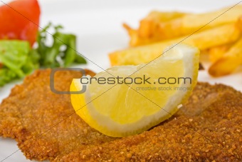 detail of a viennese schnitzel on a plate